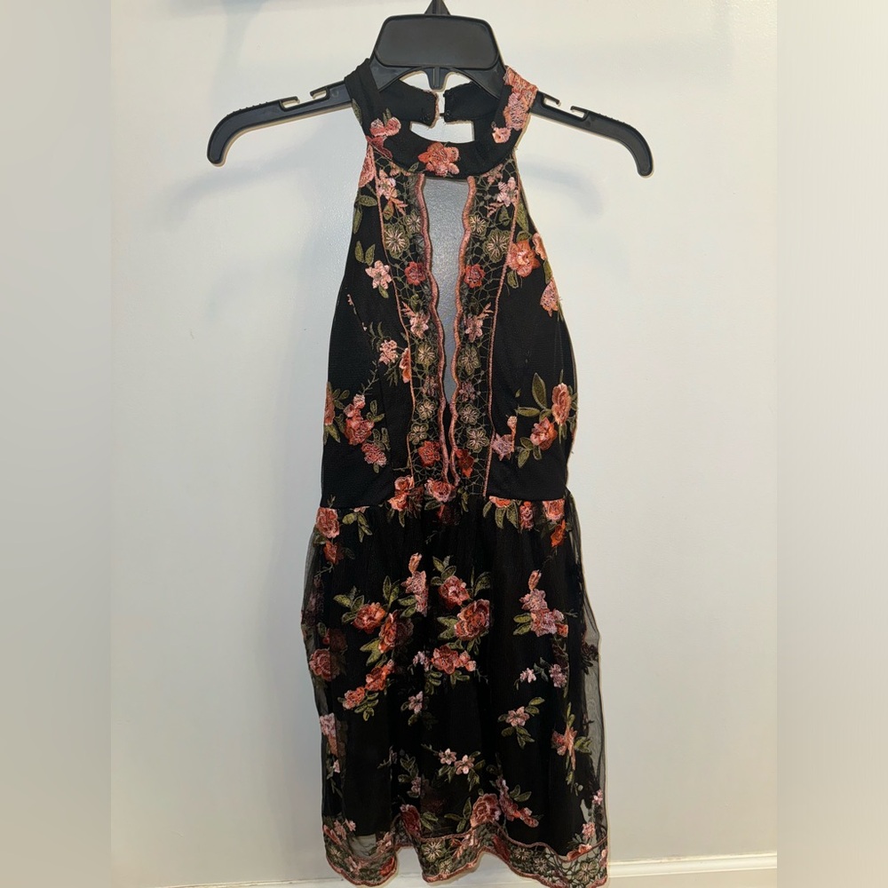 Black homecoming dress with embroidered flowers all over.